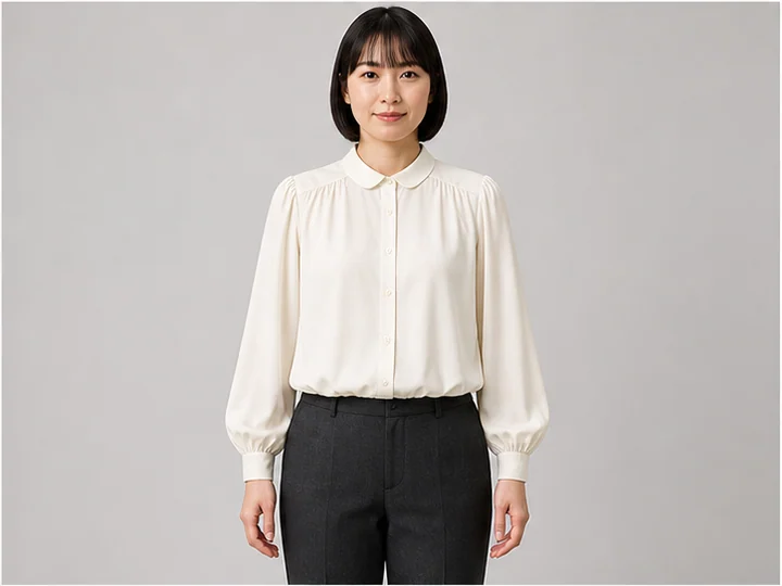 Blouse — A light soft top with fluid ease, often shaped by gathers and bloused fullness.