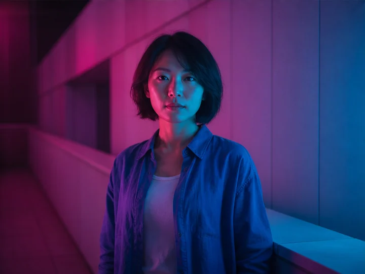 Neon lighting — Night lighting that models the face and space with vivid differently colored luminous sources.